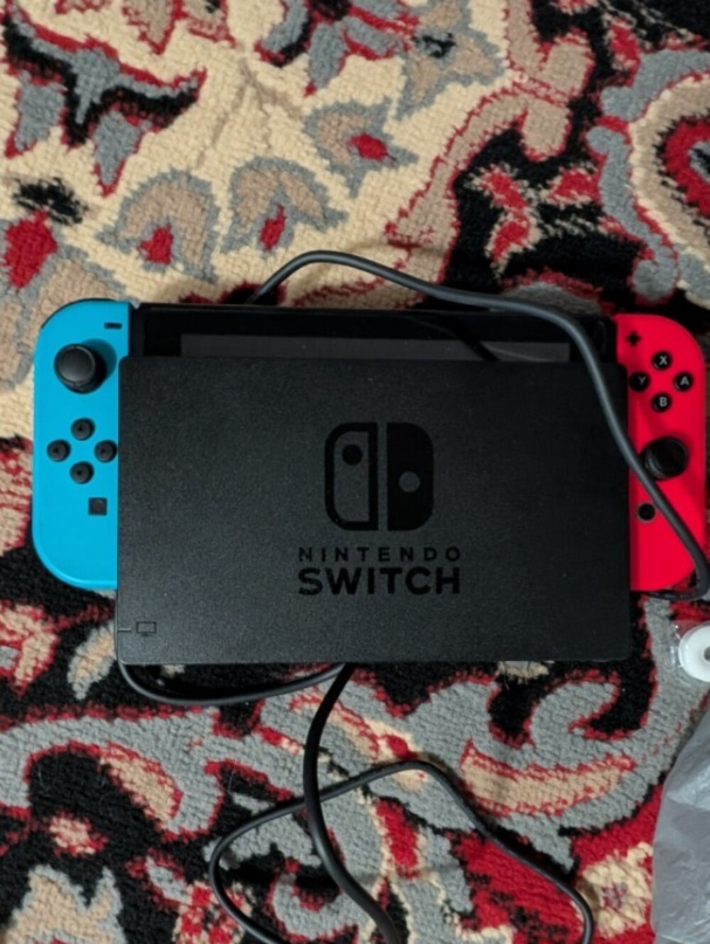 Nintendo Switch with Neon Red and Neon Blue Joy‑Con